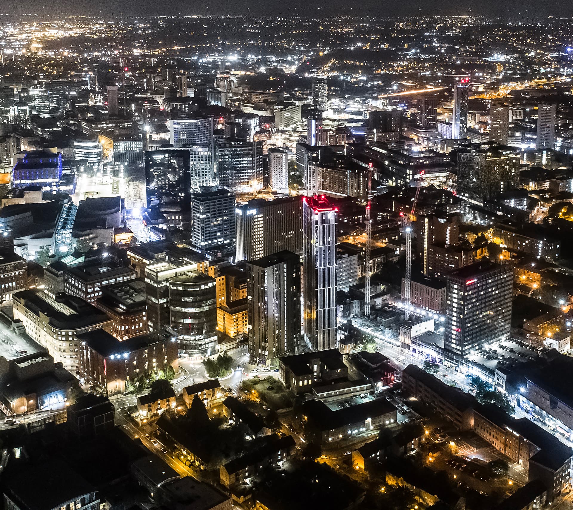 Aerial of Birmingham City Centre at night.